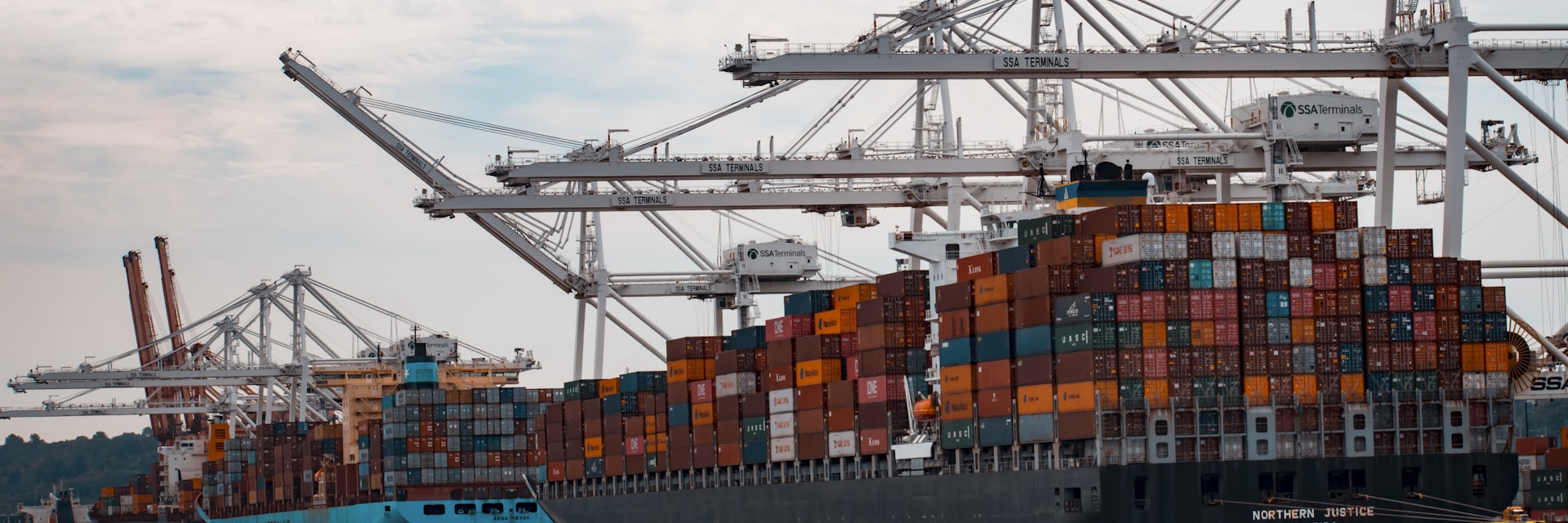 Container ship approaching a port terminal at sea